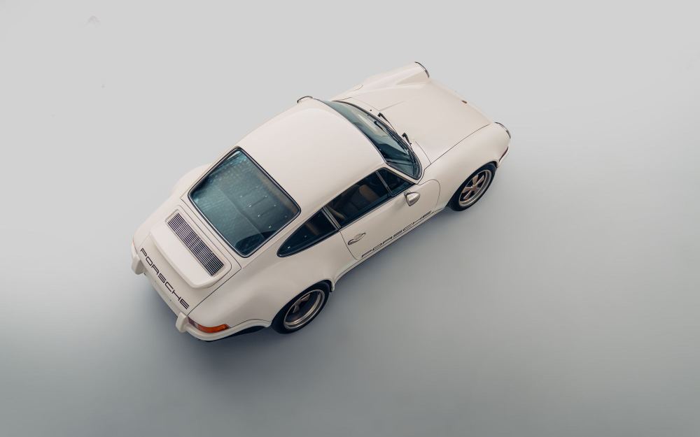Cream Coupé, a Porsche 911 (964) reimagined by Theon Design: overhead rear three-quarter view in the studio
