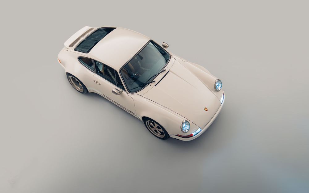 Cream Coupé, a Porsche 911 (964) reimagined by Theon Design: overhead front three-quarter view in the studio