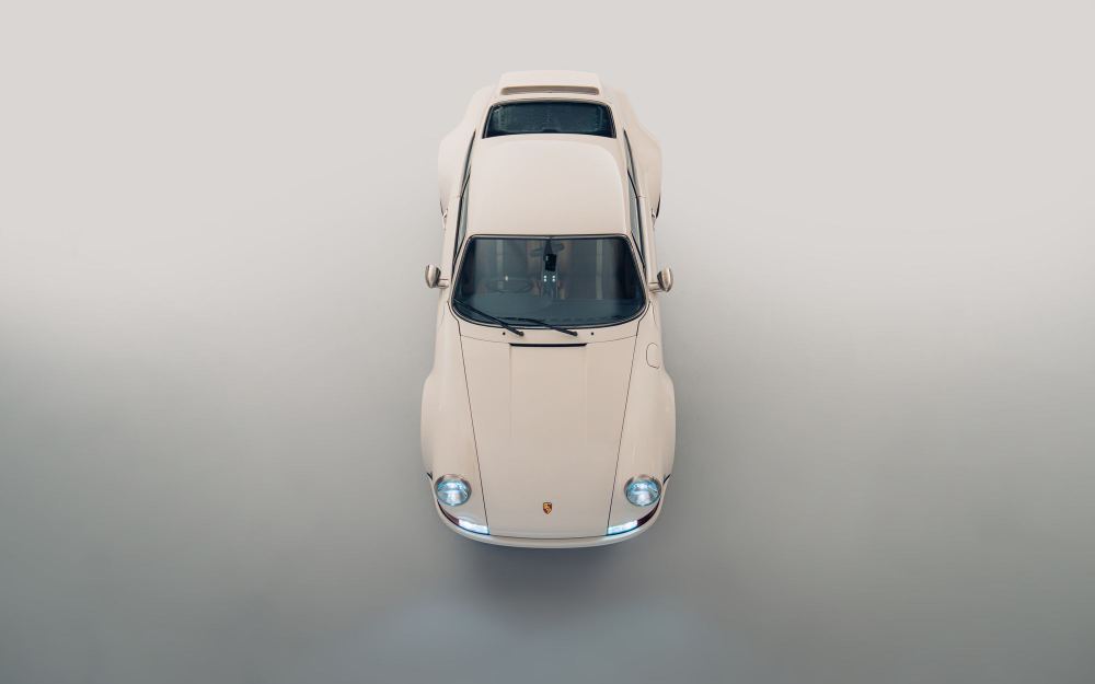 Cream Coupé, a Porsche 911 (964) reimagined by Theon Design: overhead view from the front in the studio