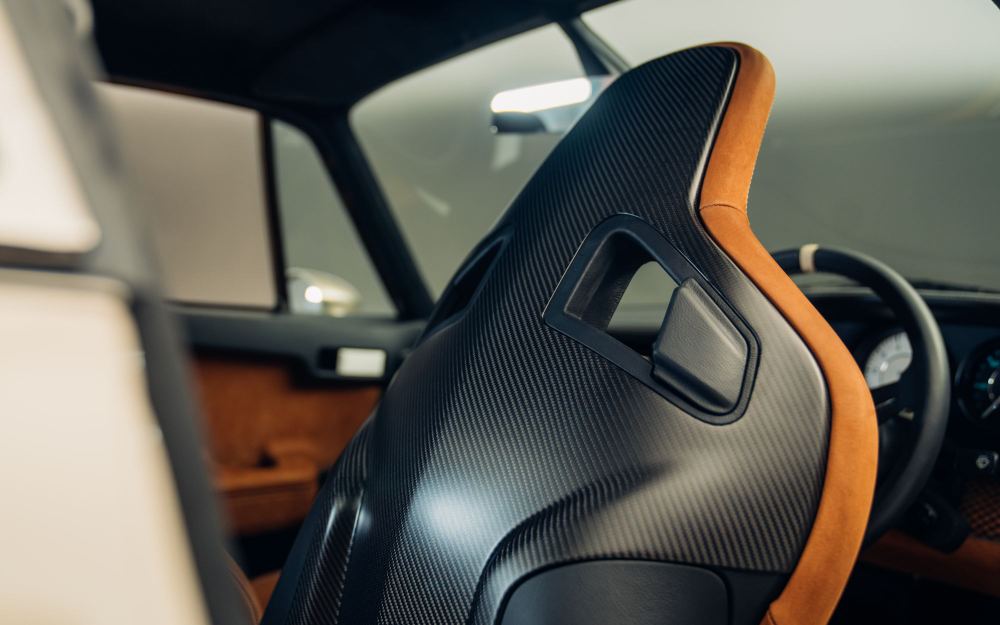 Cream Coupé, a Porsche 911 (964) reimagined by Theon Design: carbon fibre seat back trimmed in tan leather