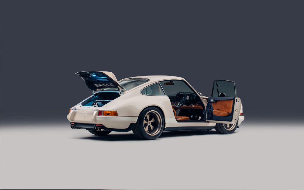 Cream Coupé, a Porsche 911 (964) reimagined by Theon Design: rear three-quarter view with the engine lid and door open