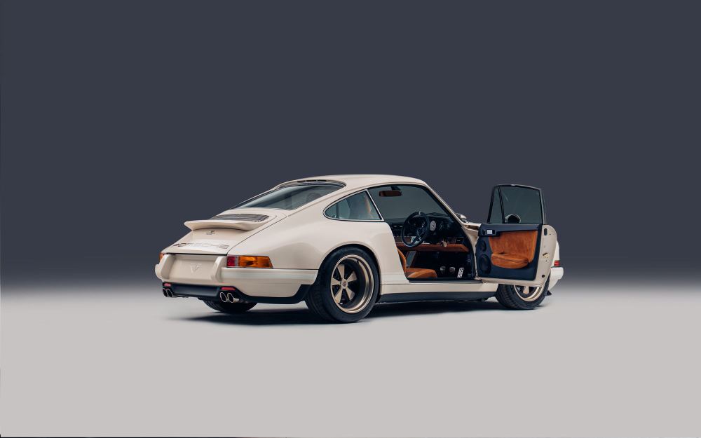 Cream Coupé, a Porsche 911 (964) reimagined by Theon Design: rear three-quarter view with the driver's door open