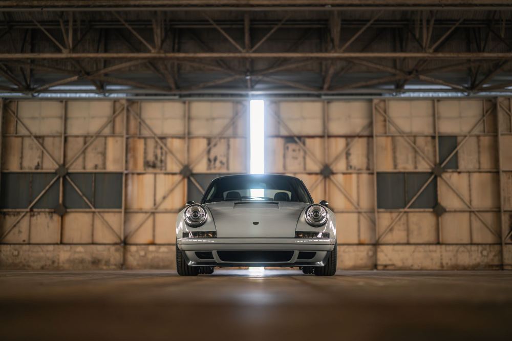Silver Coupé, a Porsche 911 (964) reimagined by Theon Design: front view inside a hangar