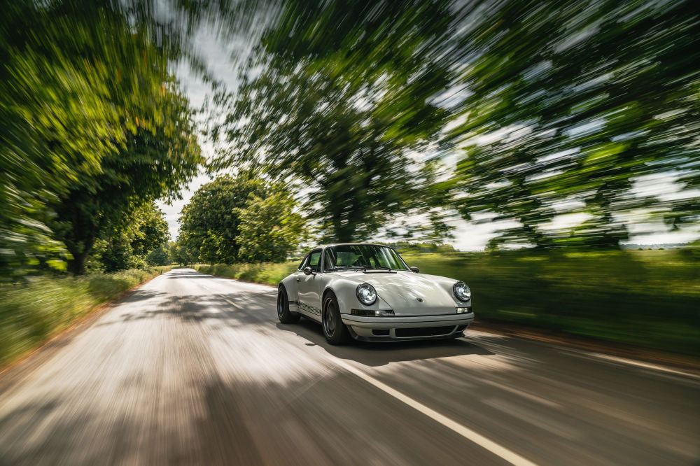 Silver Coupé, a Porsche 911 (964) reimagined by Theon Design: driving along a country road
